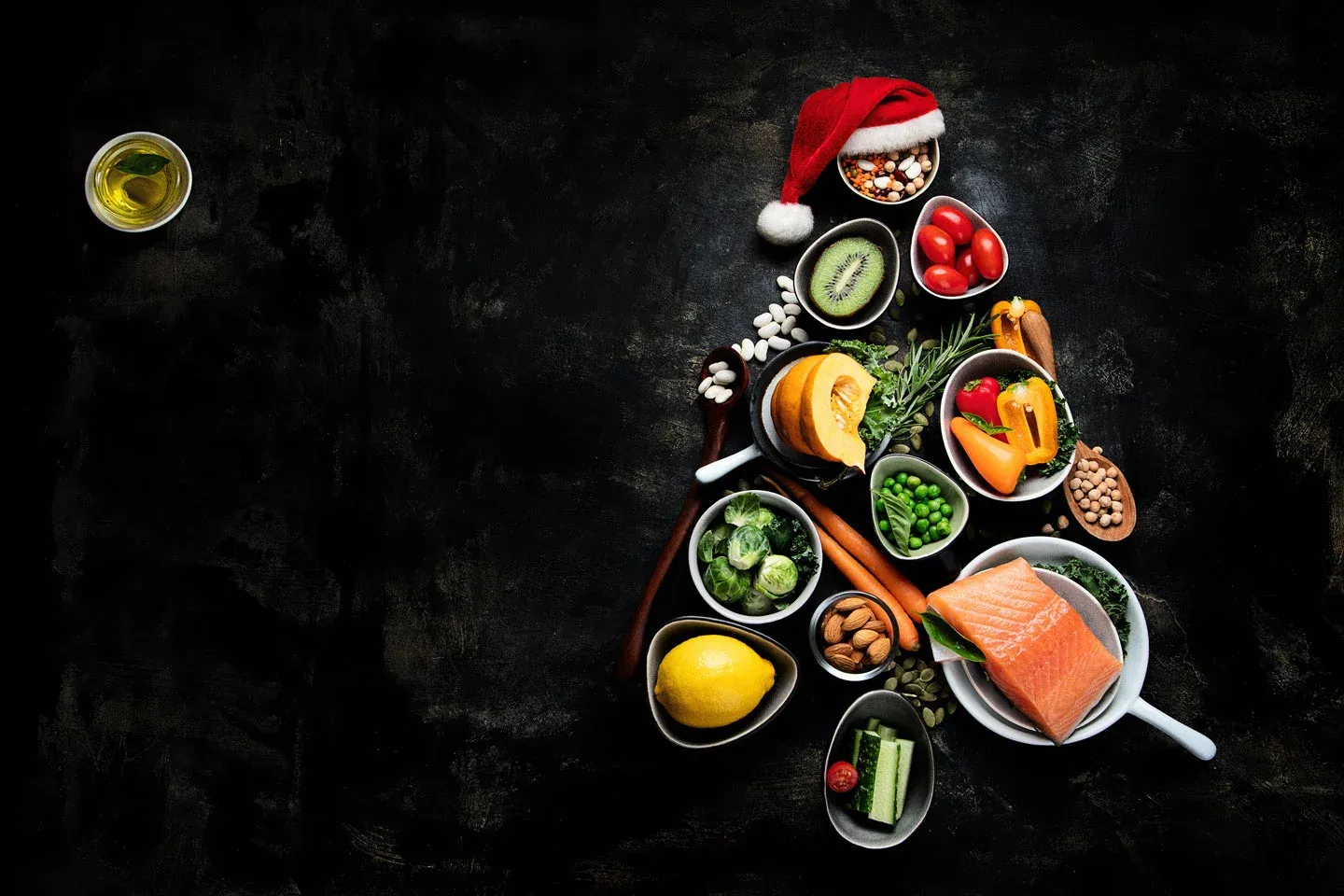 Christmas tree shape of healthy foods with Santa hat.