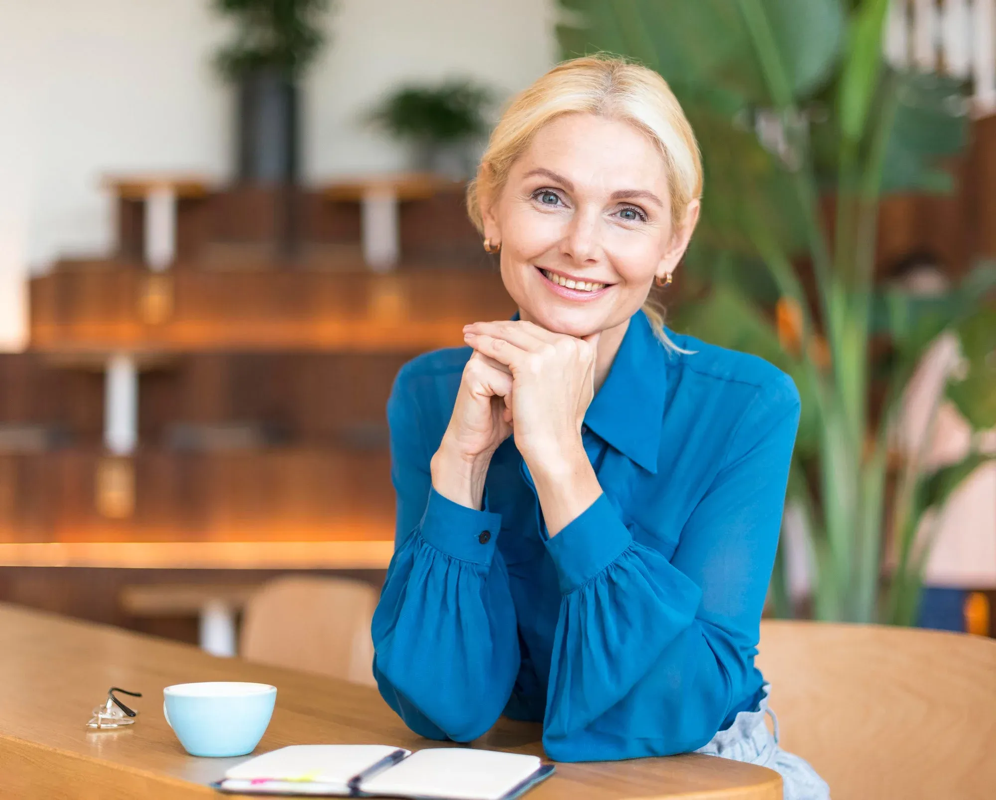 Confident middle age woman posing while smiling