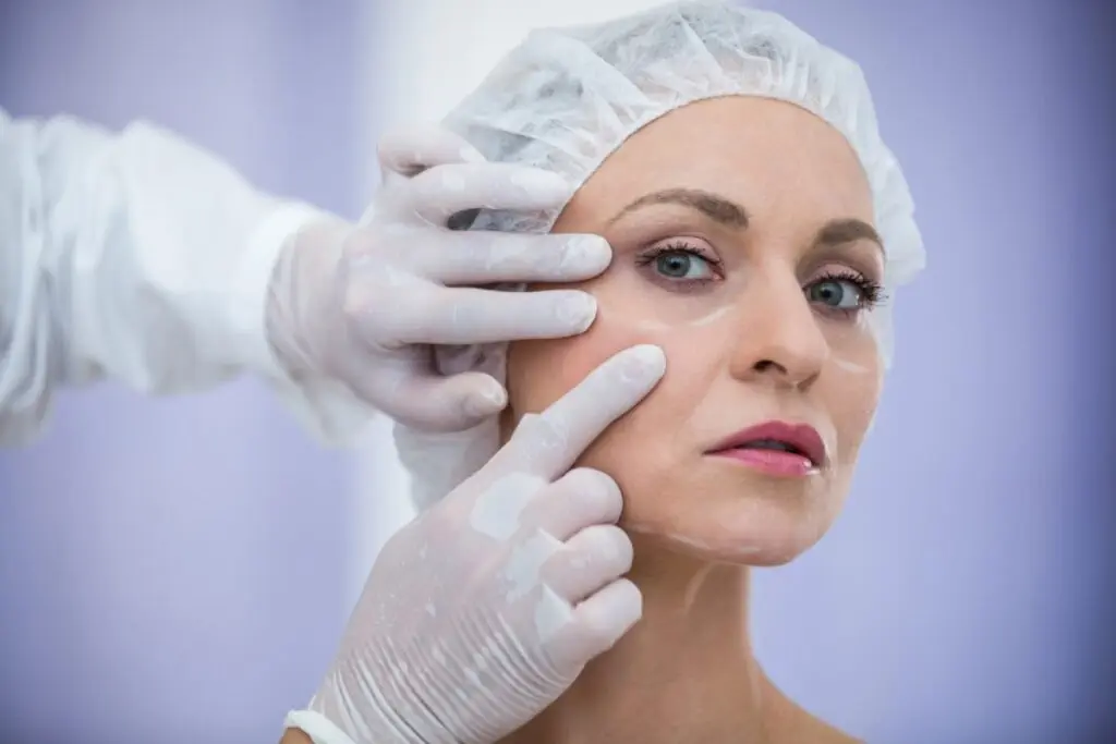doctor examining patient for plastic surgery