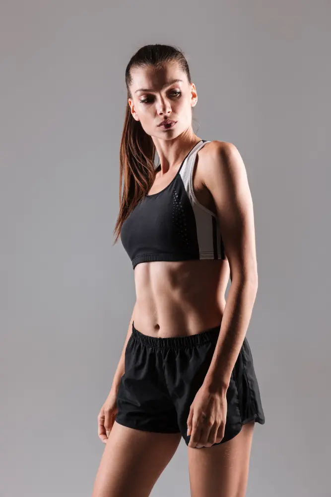 Portrait of a concentrated young fitness woman posing