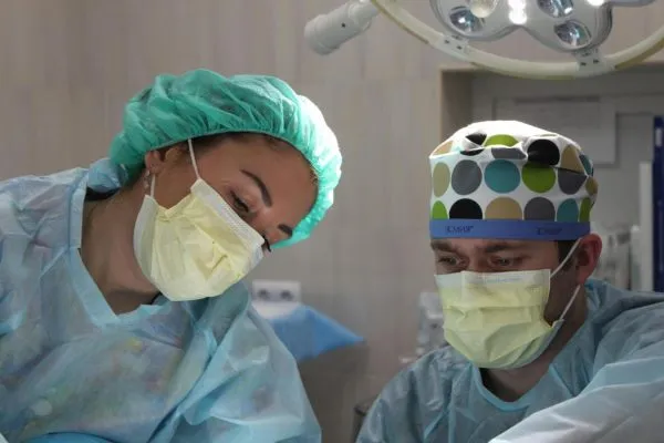 Certified plastic surgeons conducting plastic surgery