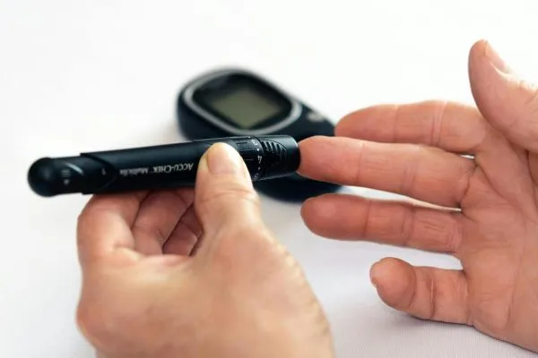 A person checking their sugar level