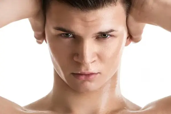 A healthy young man enjoying longer-lasting non-surgical jawline contouring