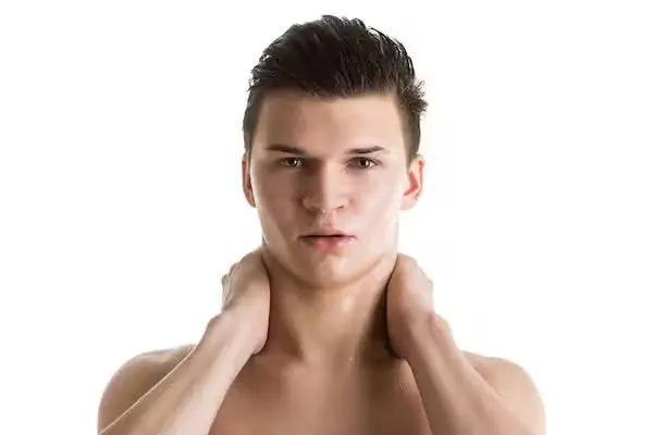A man gaining confidence after a non-surgical jawline contouring procedure