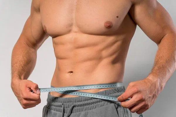 The image shows a Sculpted Look with Male Abdominal Liposuction