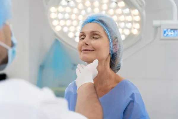 surgeon-checking-patient-for-cosmetic-surgery