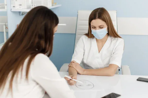 Patient consulting her concerns to a plastic surgeon