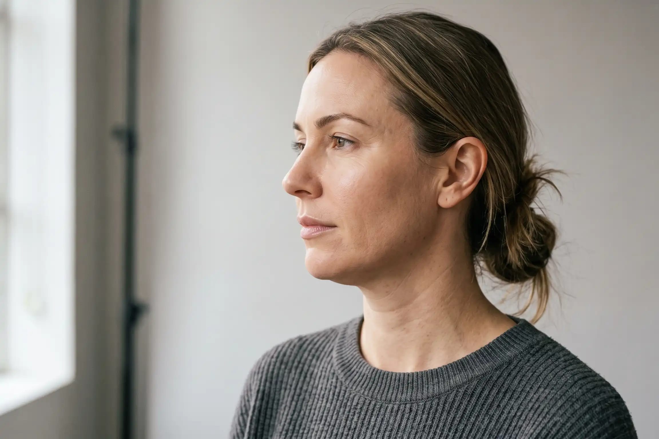 Side profile showing mild neck sagging before non-surgical neck treatment